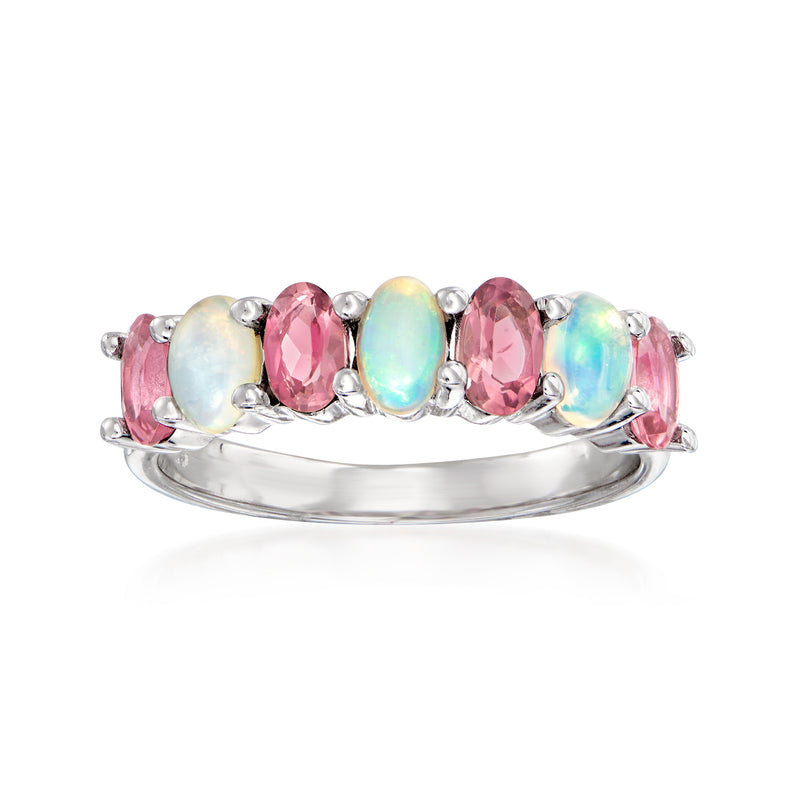 Sterling silver ring with pink gemstone and opal-like oval center stones, prong set