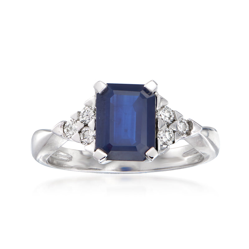 14kt white gold ring with blue emerald-cut sapphire center and diamond side stones