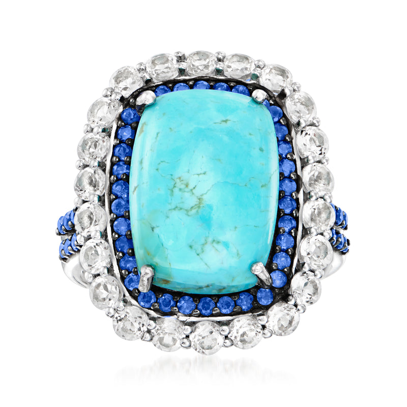 Sterling silver ring with oval turquoise gemstone, blue sapphire border, white topaz halo
