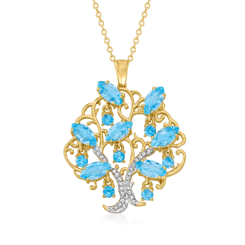 Gold-tone tree of life pendant necklace with blue topaz-style stones and zircon accents.