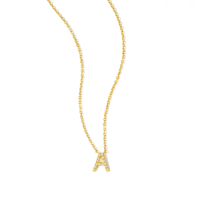 Gold initial A necklace with sparkling diamond-like stones on a fine link chain