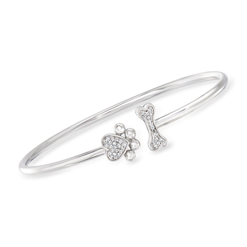 Sterling silver cuff bracelet with diamond paw and bone charm accents