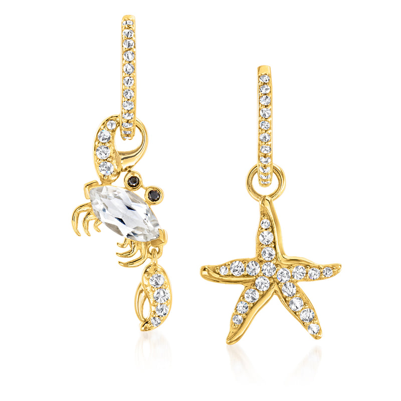 Gold drop earrings with starfish and crab charms, clear stones, black eye detail