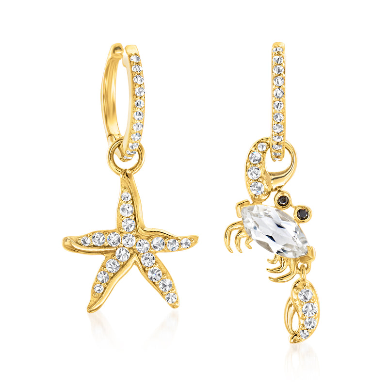 Mismatched gold drop earrings with white topaz starfish and crab, black spinel accents