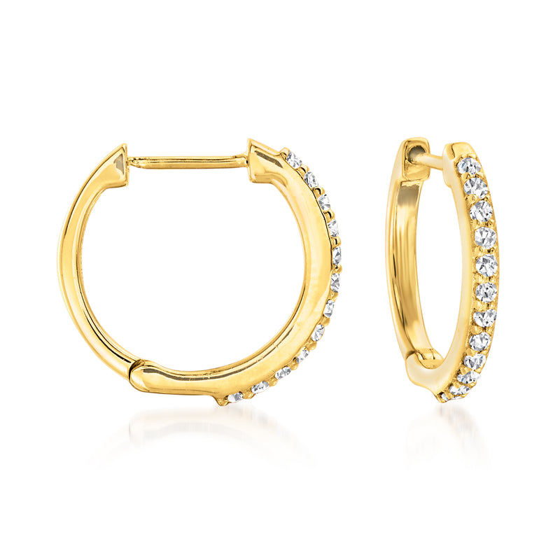 Gold hoop earrings with white stones along one side