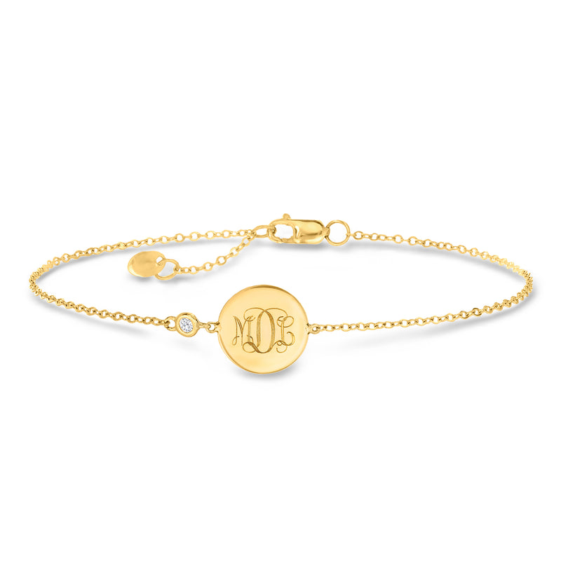 14kt yellow gold bracelet with round disc, monogram, single diamond and lobster clasp