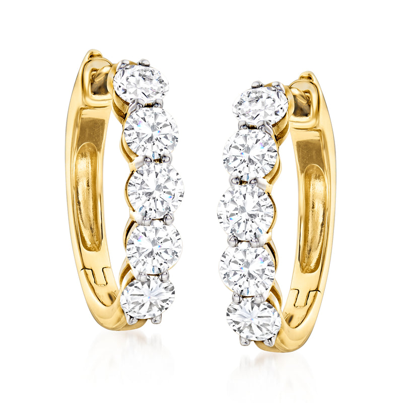 Yellow gold hoop earrings featuring five round diamonds per hoop, front view