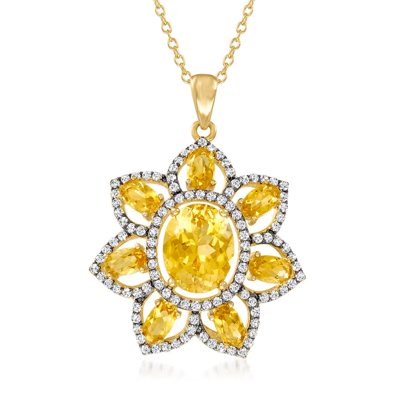 Gold flower pendant necklace with oval citrine center and white topaz accents