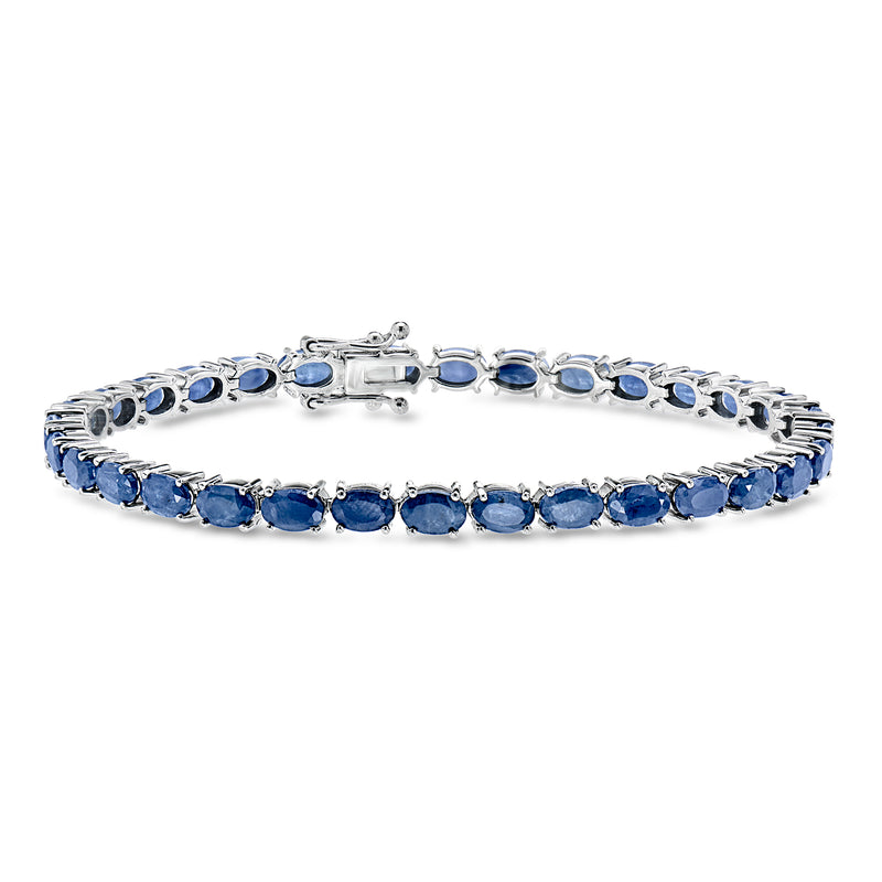 Sterling silver tennis bracelet with oval blue sapphire stones and clasp