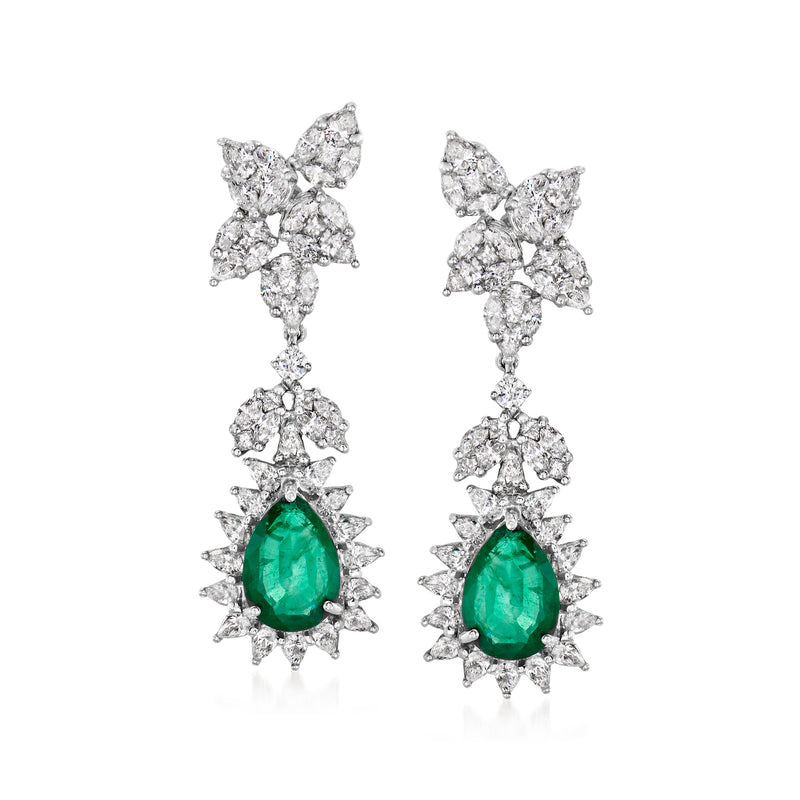 Emerald teardrop drop earrings with diamond clusters in 18k white gold.