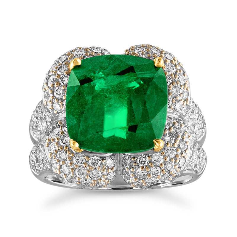 Two-tone 18kt gold ring with large emerald-cut green gemstone and diamond halo