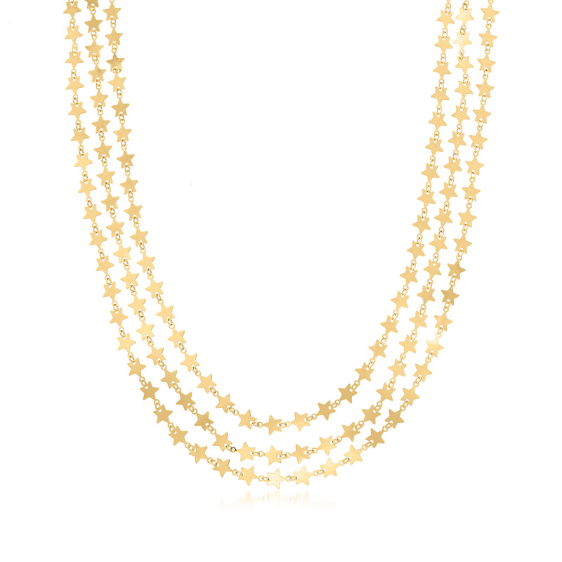 Layered gold-tone star charm necklace with two long chains and dangling star links