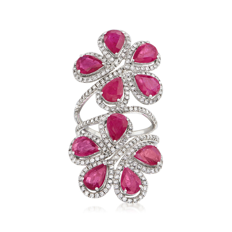 Ruby and diamond flower ring in 18kt white gold with pink ruby petals and diamond halos