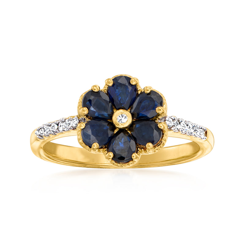 Gold-tone sapphire flower ring with round diamond center and prong-set blue stones