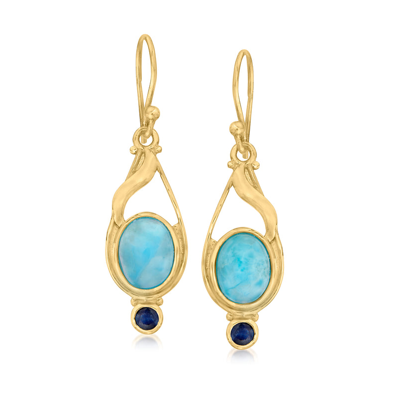 Gold drop earrings with blue oval larimar stones and small dark blue sapphire accents.