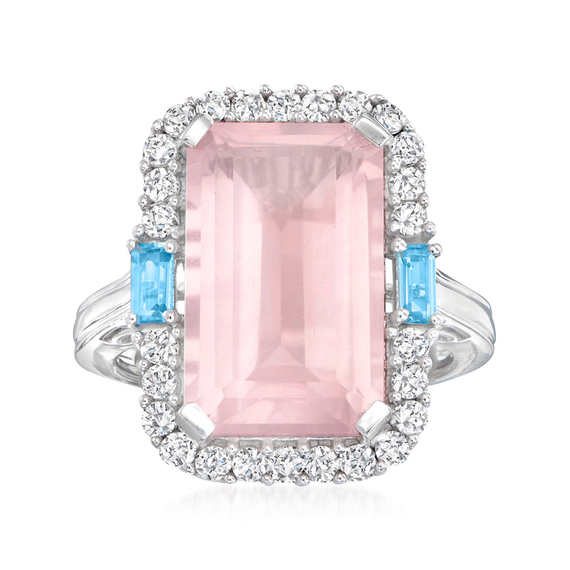 Sterling silver ring with pink rose quartz center, white zircon halo, blue topaz accents