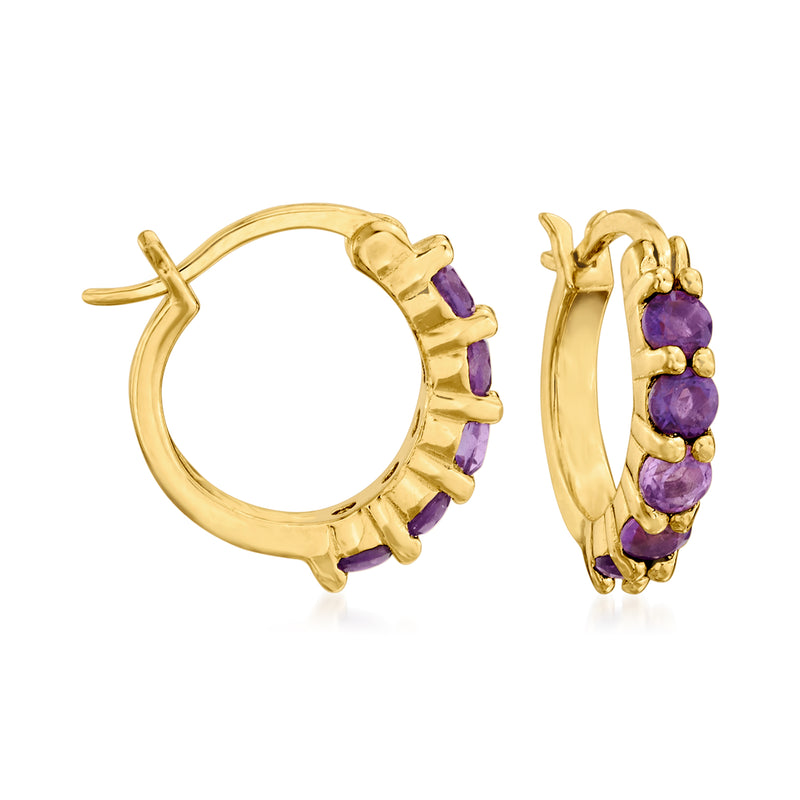 Gold-tone huggie hoop earrings with purple gemstone row detail