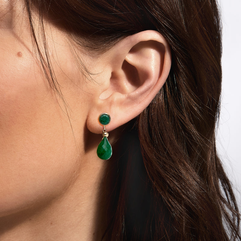 Green teardrop earrings in 14kt yellow gold, shown on model ear