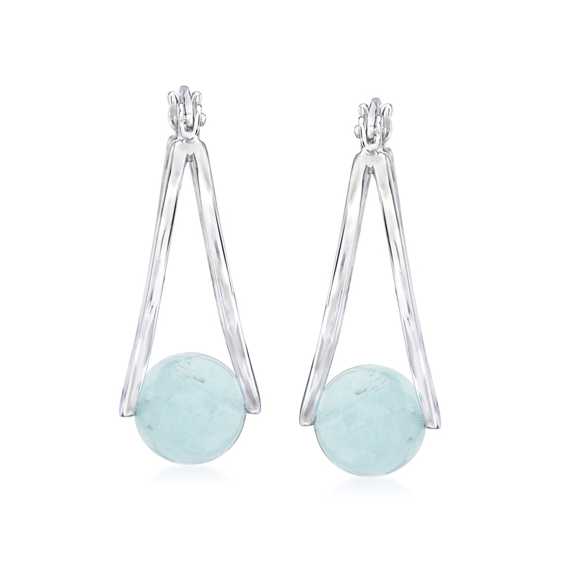 Sterling silver double-hoop earrings with oval light blue aquamarine gemstone at center