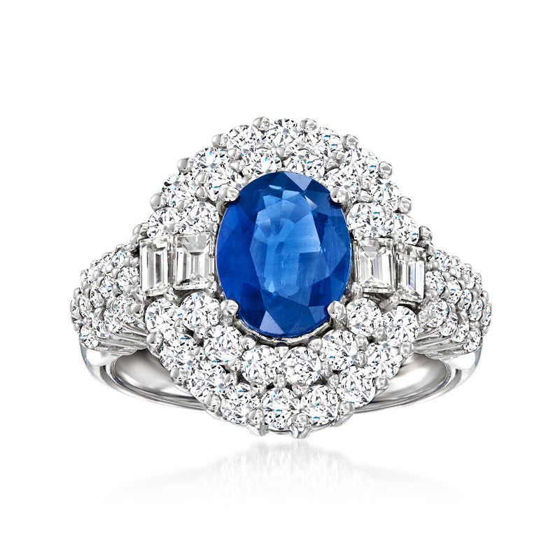 14kt white gold sapphire and diamond ring with oval blue center and diamond halo