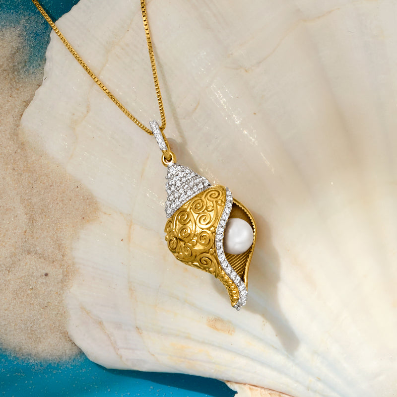 Seashell pendant necklace detail: gold-tone shell with cultured pearl and white topaz sparkle
