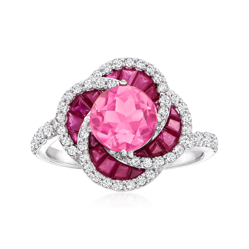 14kt white gold ring with pink tourmaline center, ruby halo, and diamond accents