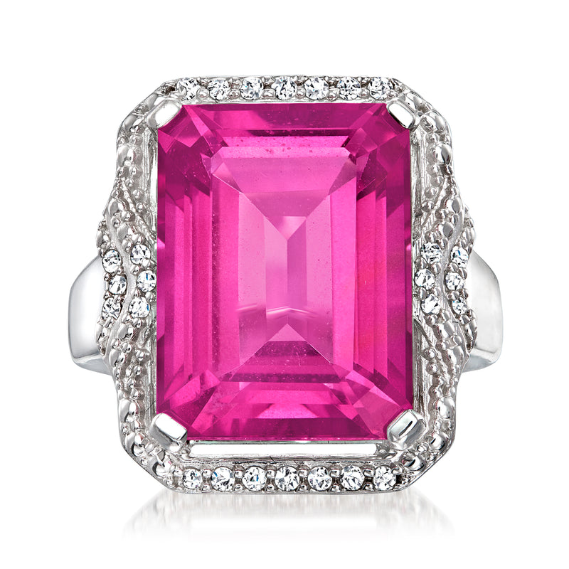 Sterling silver ring with large pink topaz center and diamond halo setting