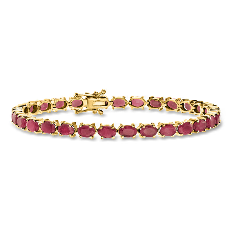 Gold-tone ruby bracelet with oval pink stones in a tennis style row