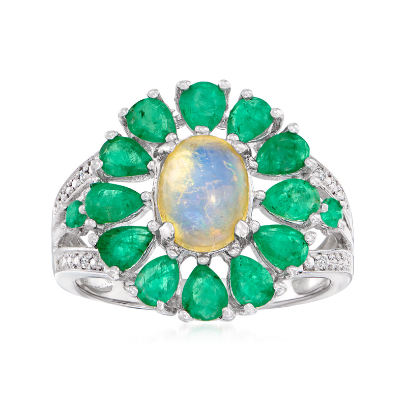 Sterling silver ring with oval opal center, green emerald stones, and diamond accents