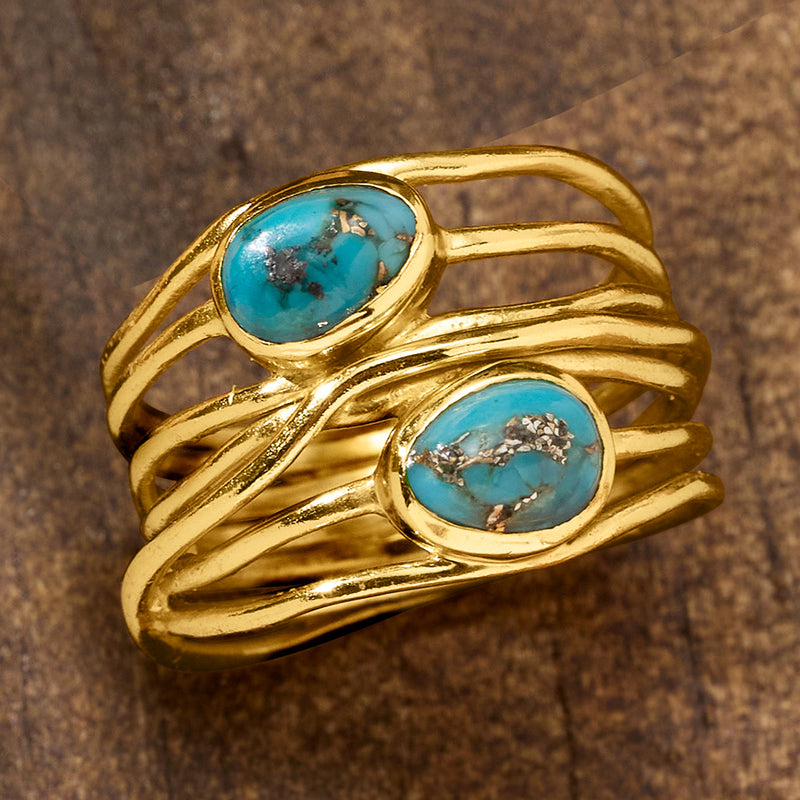 Gold over sterling turquoise oval cabochon ring with layered twisted gold bands