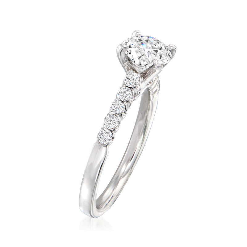 14kt white gold diamond ring setting with raised round center stone and three side diamonds