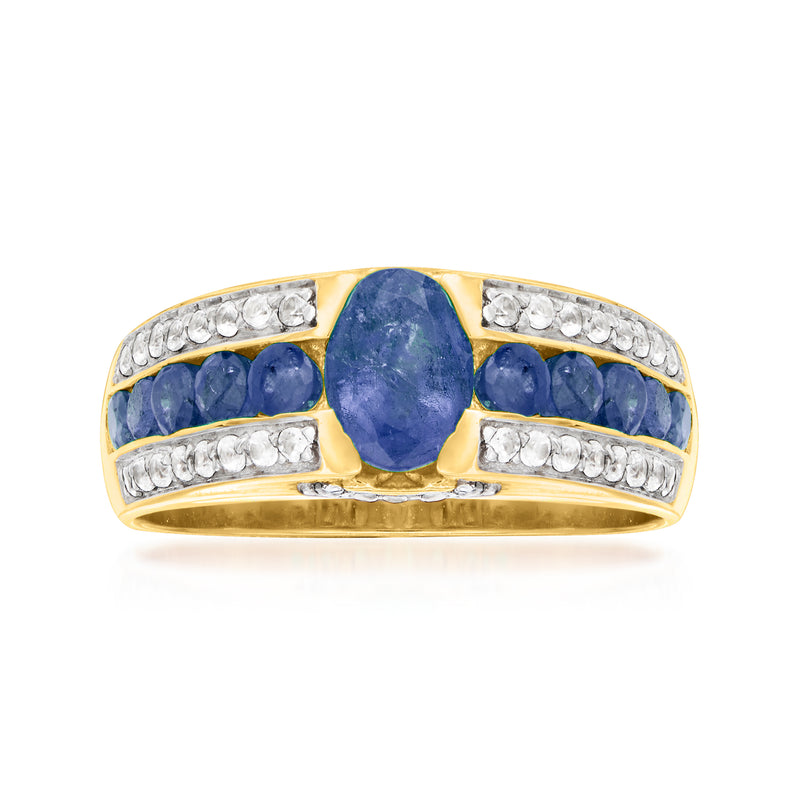 Gold over sterling ring with oval blue sapphire center, white zircon rows, and blue side stones