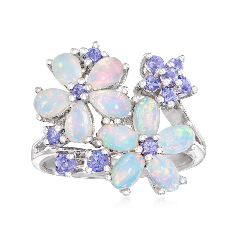 Opal and tanzanite flower ring in sterling silver with opalescent petals and violet stones