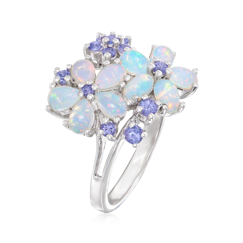 Sterling silver opal and tanzanite flower ring with opalescent petals and purple accents