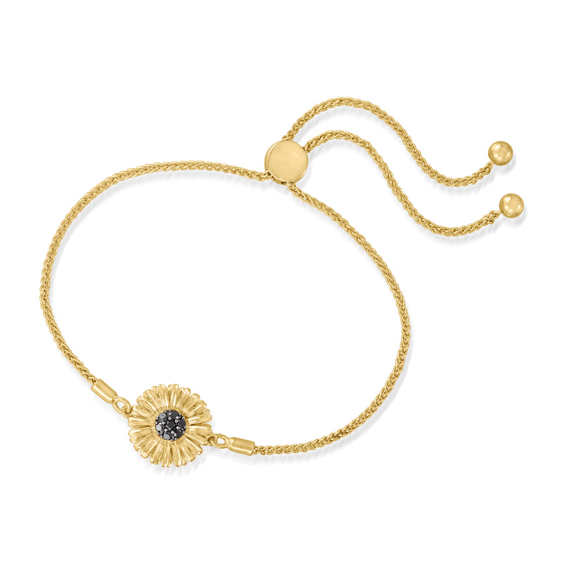 Gold bolo bracelet with sunflower charm and dark center stone, adjustable chain