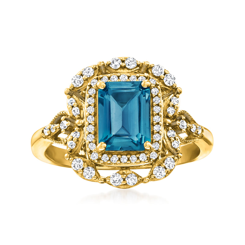 14kt yellow gold ring with rectangular London blue topaz center and diamond halo