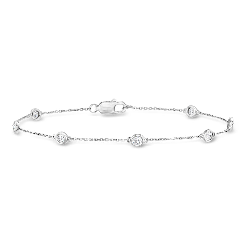 Sterling silver diamond station bracelet with five round sparkle stones