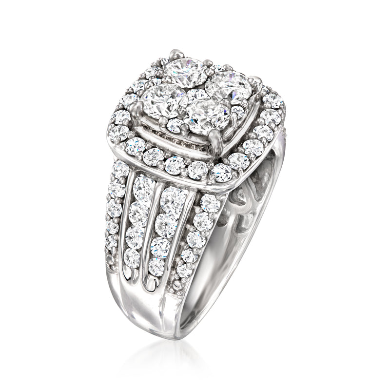 Diamond cluster ring in 14kt white gold with pavé shoulders and halo top