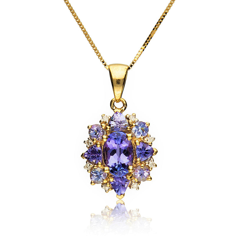 14kt yellow gold tanzanite pendant with oval blue center and diamond halo