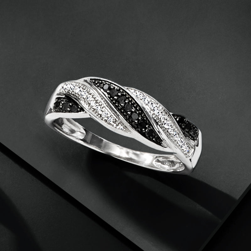 Sterling silver twisted ring with black and white diamonds