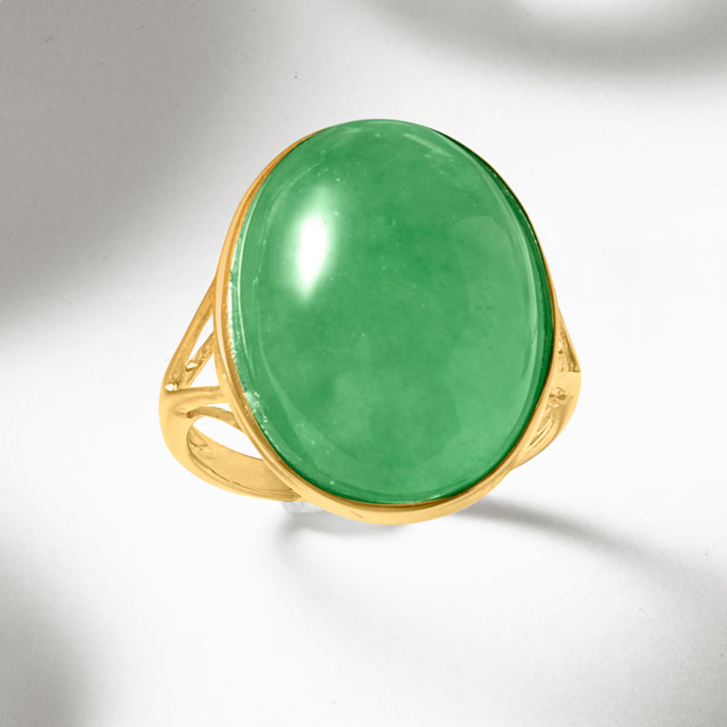 Oval jade-green gemstone ring in 14k yellow gold with split band