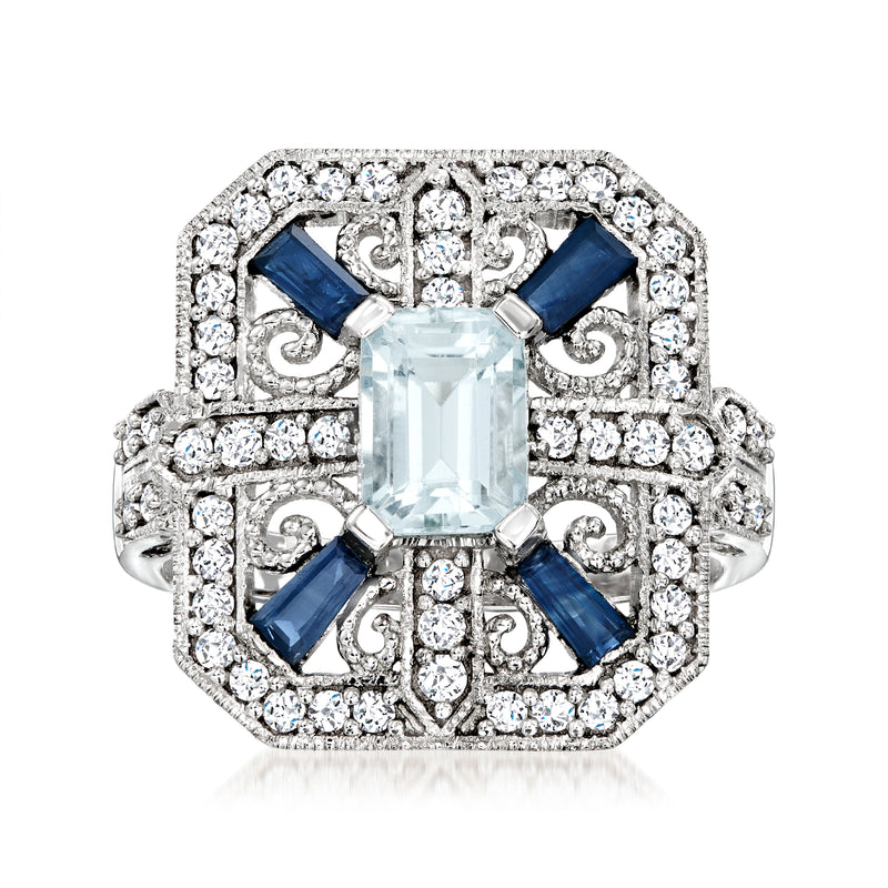 14kt white gold ring with rectangular aquamarine center, blue sapphires, diamond halo