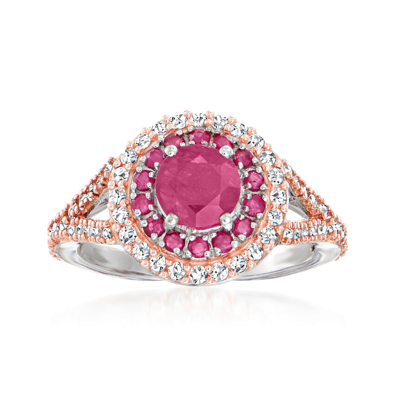 Ruby and diamond halo ring in two-tone 14kt gold with oval center stone and round accents
