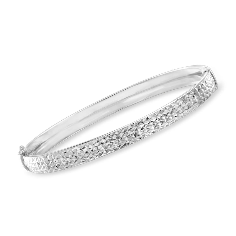Sterling silver diamond-cut bangle bracelet with faceted pattern along the band