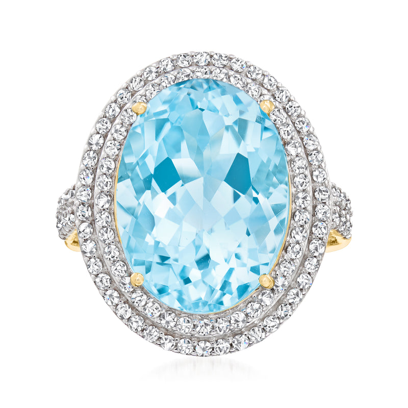 Sky blue topaz and diamond halo ring in 14kt yellow gold