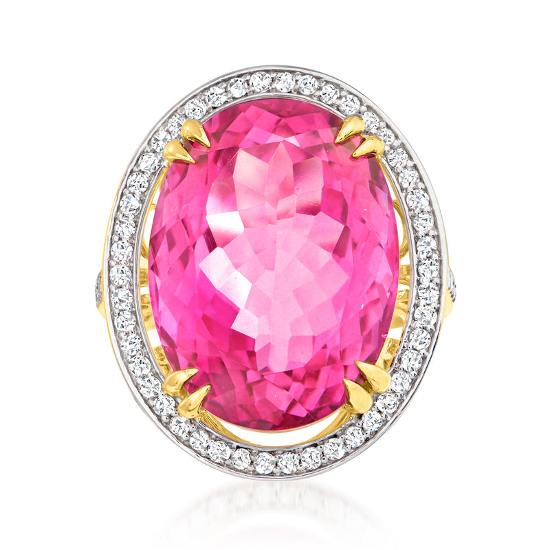 Oval pink topaz ring with diamond halo and gold prong setting