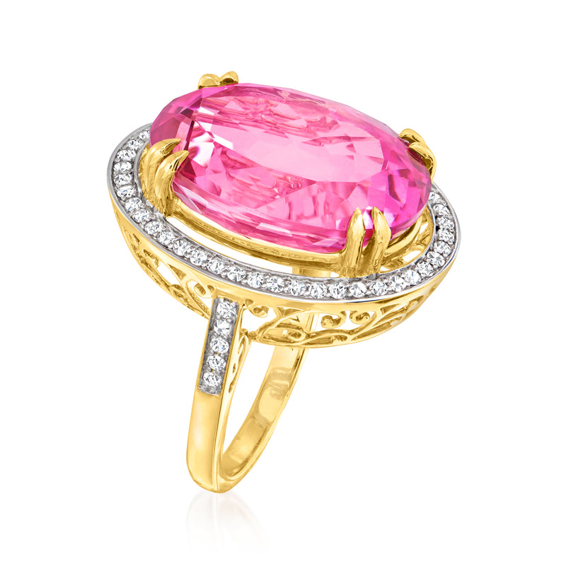 Pink gemstone oval ring with diamond halo and yellow gold band