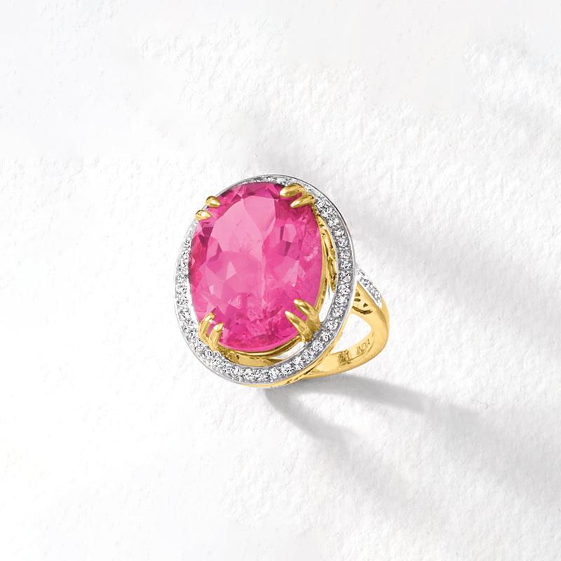 Pink topaz oval ring with diamond halo and yellow gold side detail