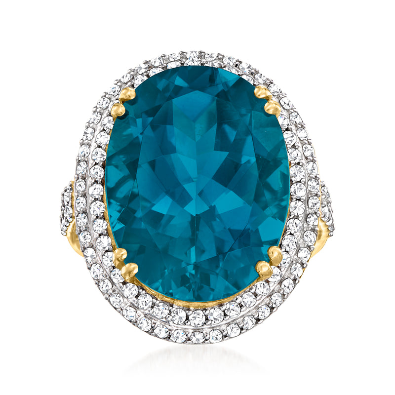 14kt yellow gold ring, oval London blue topaz with diamond halo