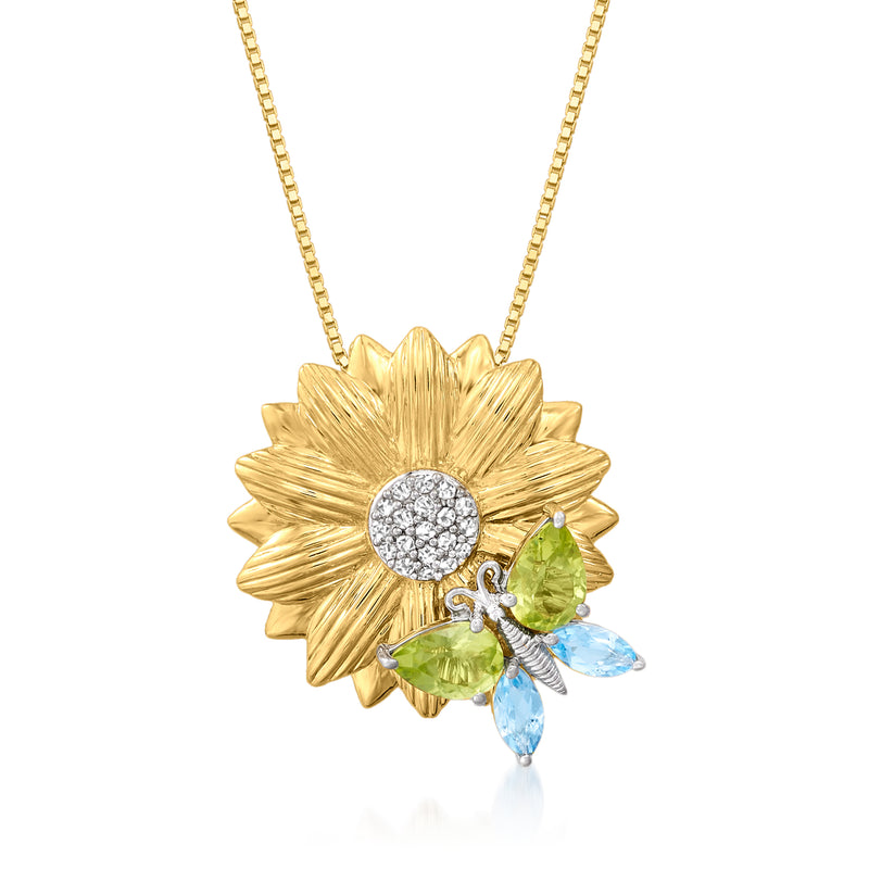 Gold flower pendant necklace with round white center, green and blue gem drops